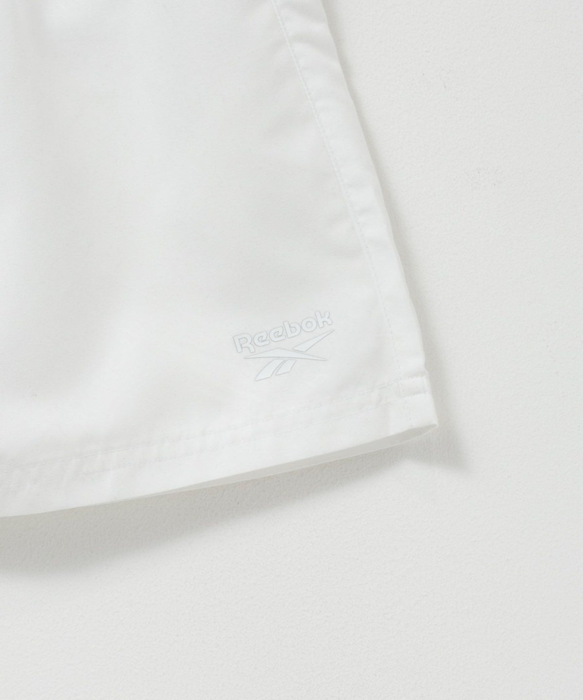 Reebok エンボスサーフショートパンツ メンズ