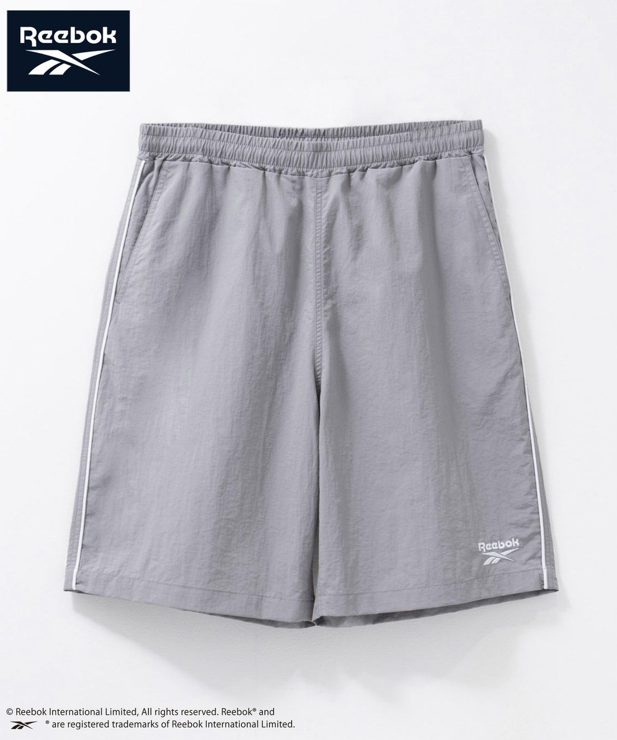Reebok ナイロンパイピングショートパンツ メンズReebok ナイロンパイピングショートパンツ メンズ