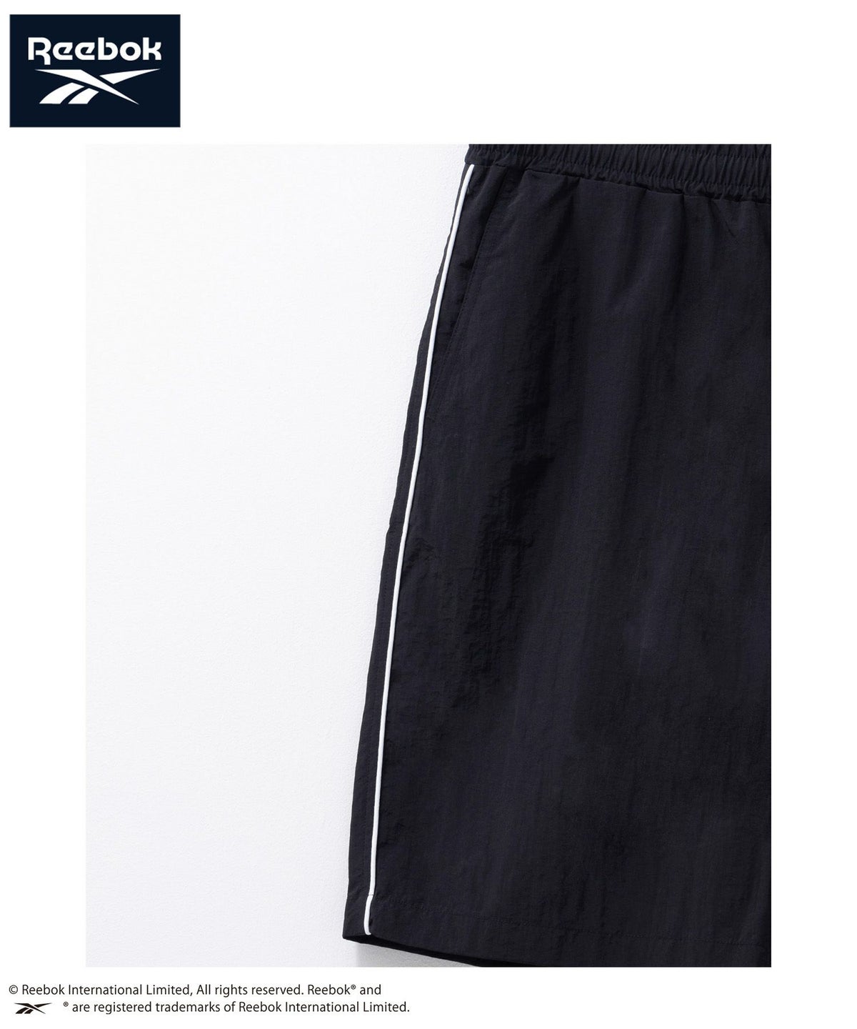 Reebok ナイロンパイピングショートパンツ メンズ