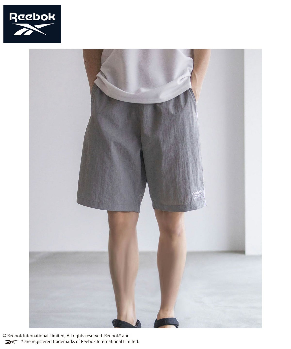 Reebok ナイロンパイピングショートパンツ メンズ