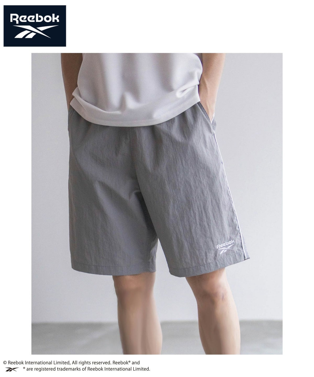 Reebok ナイロンパイピングショートパンツ メンズ
