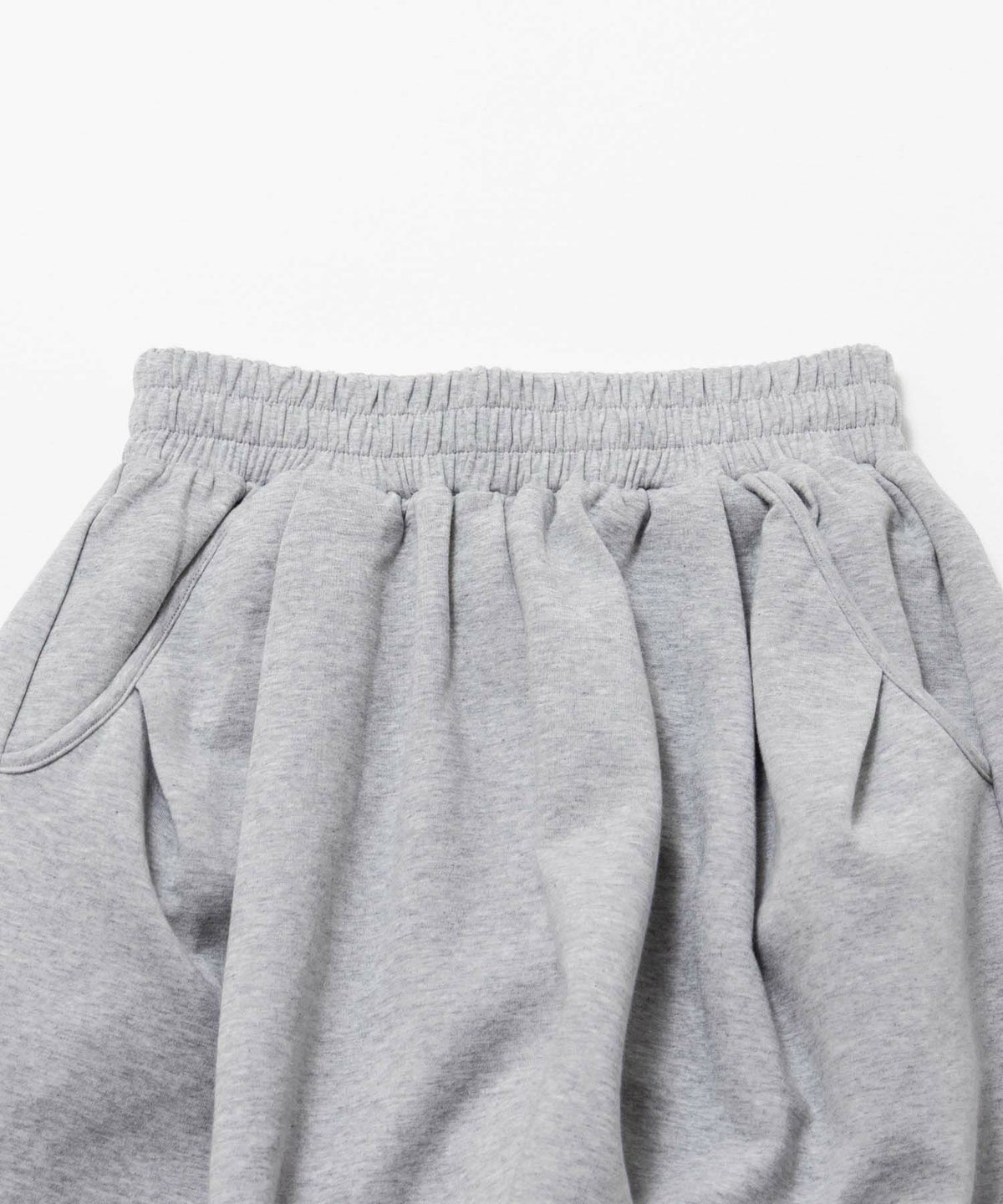 milli de l'air ポンチ素材 リラックスカーブパンツ レディース