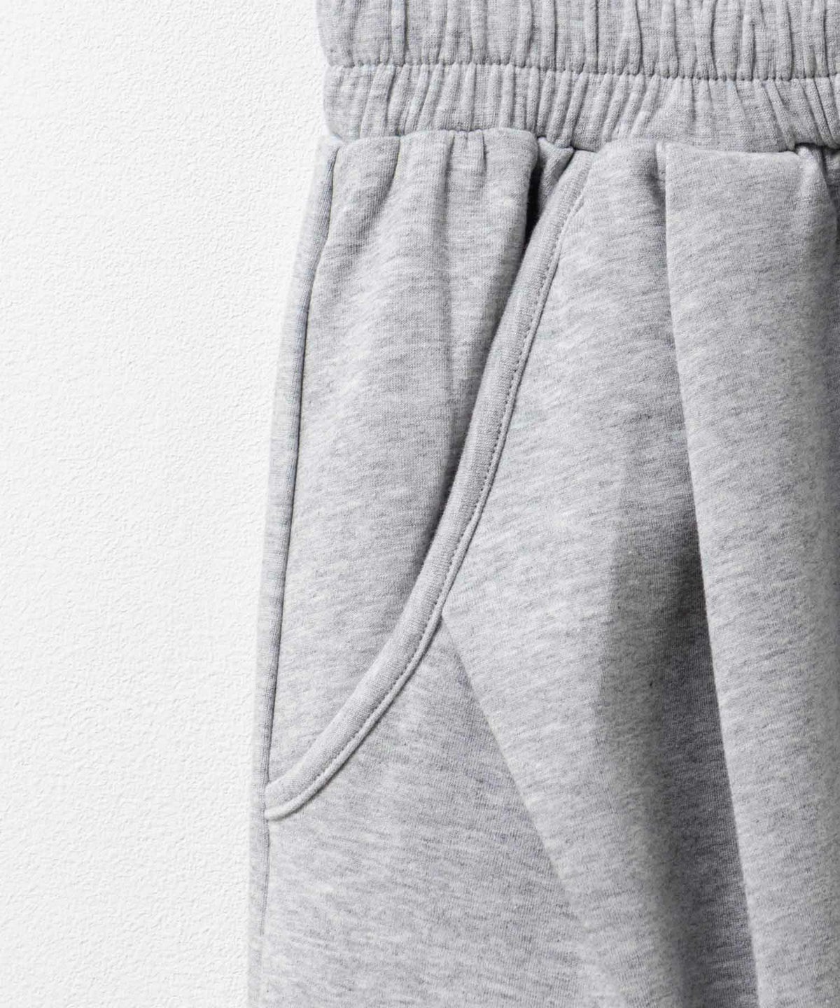 milli de l'air ポンチ素材 リラックスカーブパンツ レディース