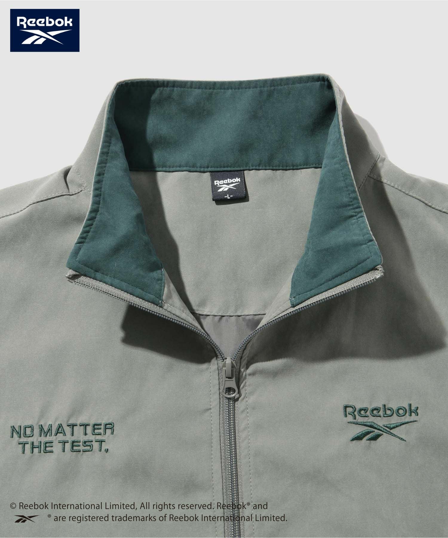 Reebok コントラストパイピングジャケット メンズ